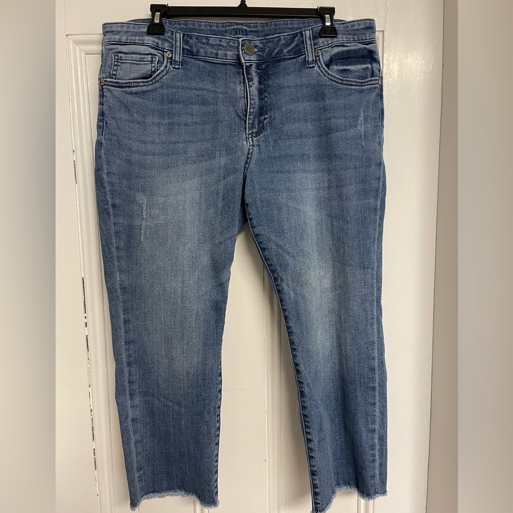 Kut from the Kloth brand crop jeans. Cut/fringe edge on the bottoms.